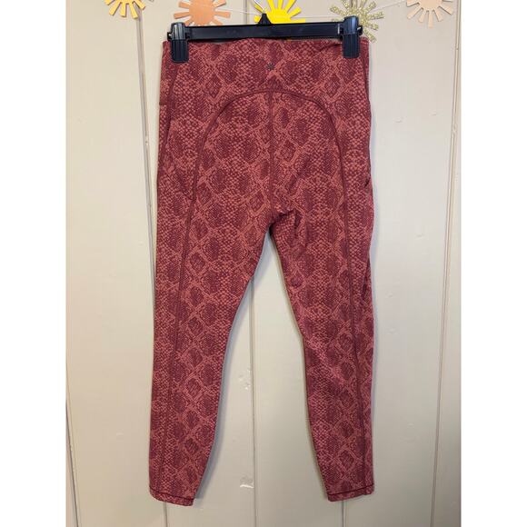 Athleta orange snake print leggings stash pocket 7/8 length small - Picture 2 of 3